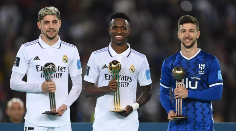 Players from Real Madrid and Al-Hilal pose with their awards after the FIFA Club World Cup final