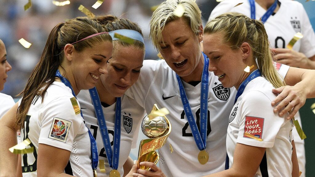 US Women's Soccer Team With FIFA Women's World Cup Trophy