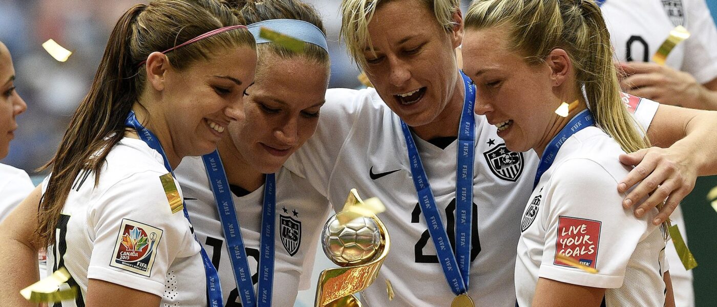 US Women's Soccer Team With FIFA Women's World Cup Trophy